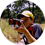 A boy with a toy laser rifle